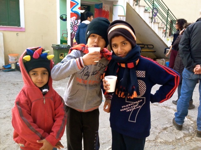 Three Syrian boys receiving welcome on the island of Lesvos in Greece in a center supported by REACT